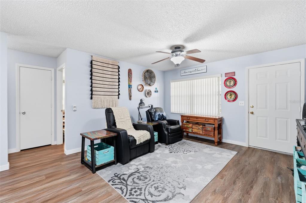 8556 Southwest 90th Lane, Unit F Ocala, FL 34481 - Photo 6 of 34 a living room with furniture and wooden floor