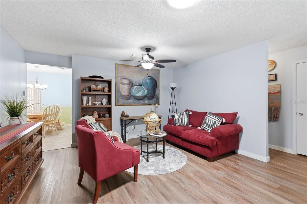 8556 Southwest 90th Lane, Unit F Ocala, FL 34481 - Photo 9 of 34 a living room with furniture cabinets and wooden floor