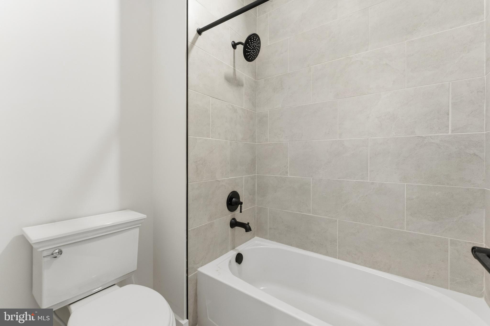 19110 Tatie Way Poolesville, MD 20837 - Photo 25 of 29 a white bath tub sitting next to a toilet