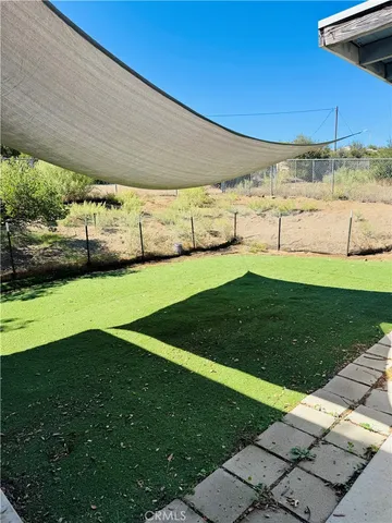 a view of yard with swimming pool