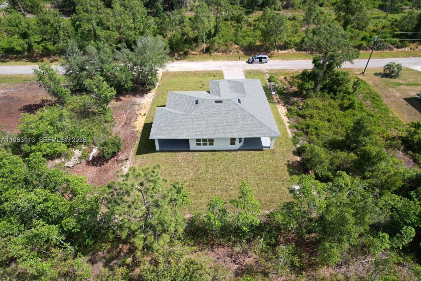 8001 Leonardo Street Sebring, FL 33872 - Photo 25 of 27 an aerial view of a house with yard swimming pool and outdoor seating