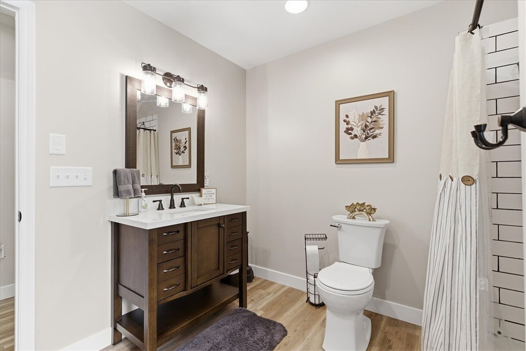 166 Amberwood Drive Anderson, SC 29621 - Photo 21 of 38 This bathroom features a contemporary vanity with ample storage and a sleek, modern toilet.