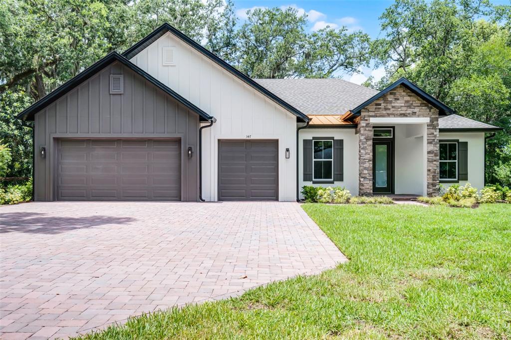 347 Mission Road Oviedo, FL 32765 - Photo 1 of 1 Exterior elevation, 3 car garage or one for golf cart