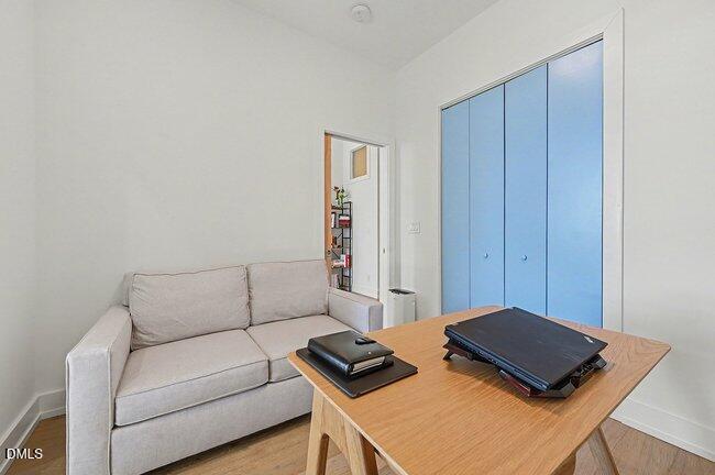 103 West Main Street, Unit 305 Durham, NC 27701 - Photo 16 of 25 a living room with a bed