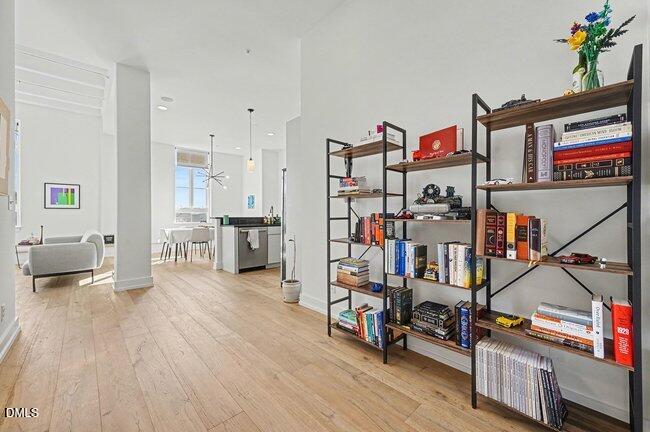 103 West Main Street, Unit 305 Durham, NC 27701 - Photo 4 of 25 a living room with lots of furniture and a wooden floor