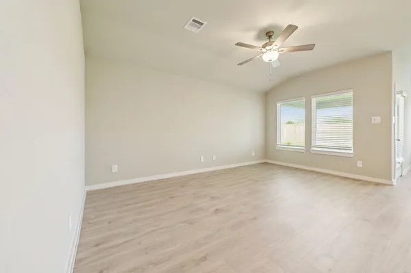 a view of an empty room with a window