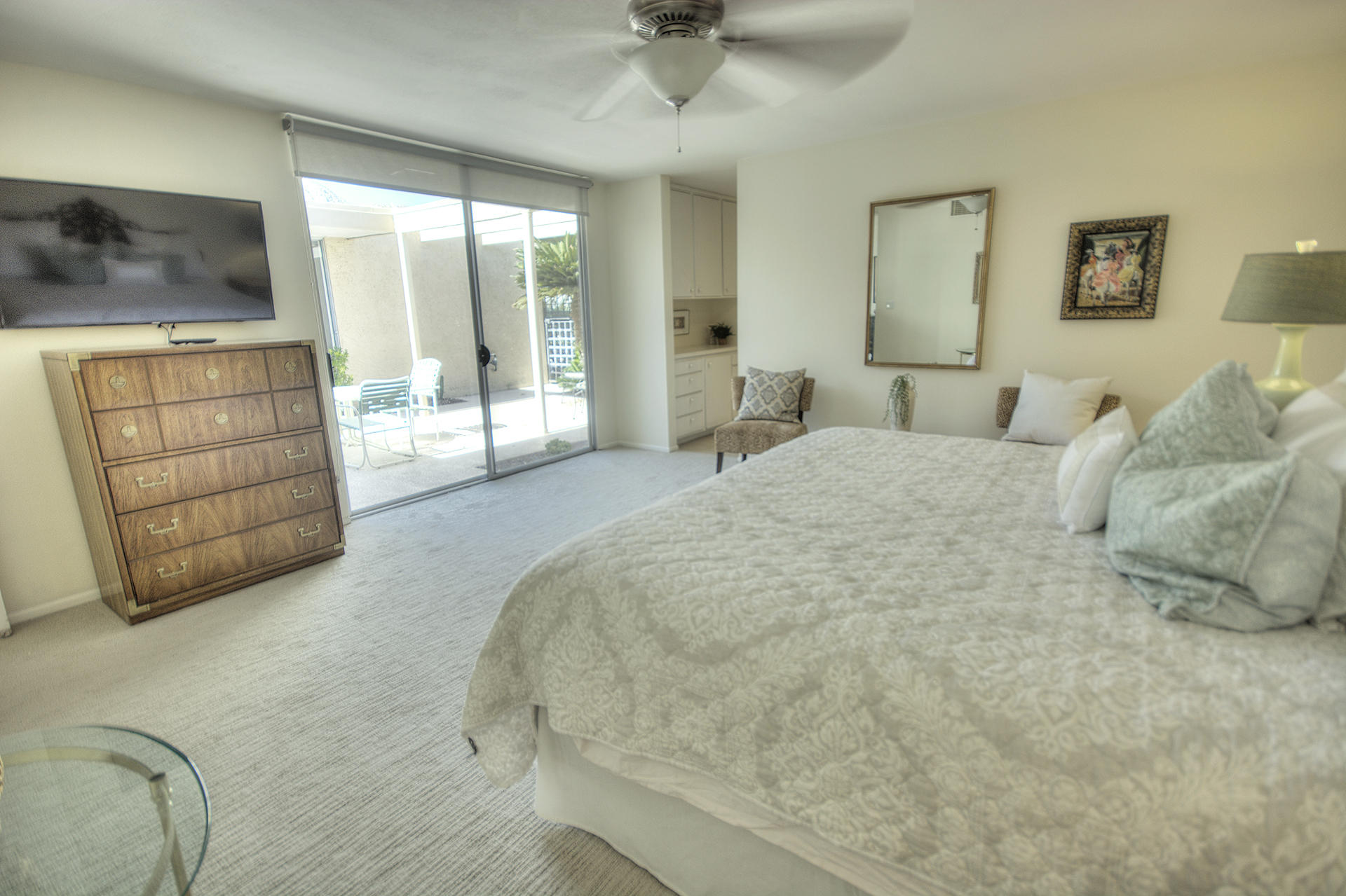 45730 Hopi Road Indian Wells, CA 92210 - Photo 14 of 42 a spacious bedroom with a bed and a dresser