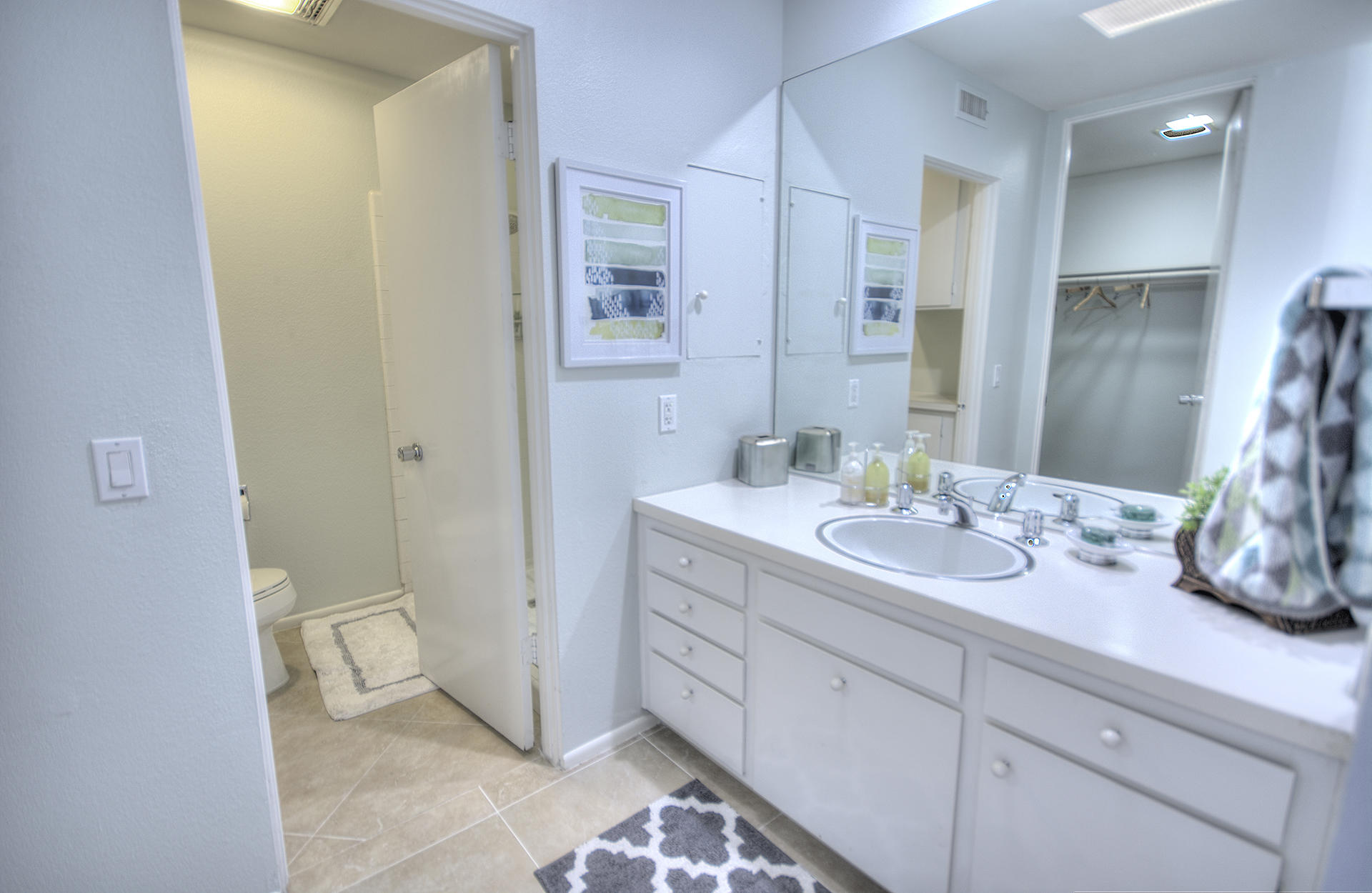 45730 Hopi Road Indian Wells, CA 92210 - Photo 20 of 42 a spacious bathroom with a double vanity sink and a mirror