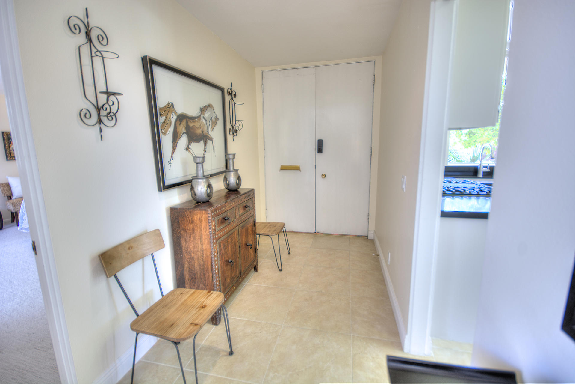 45730 Hopi Road Indian Wells, CA 92210 - Photo 3 of 42 a view of a hallway with seating area