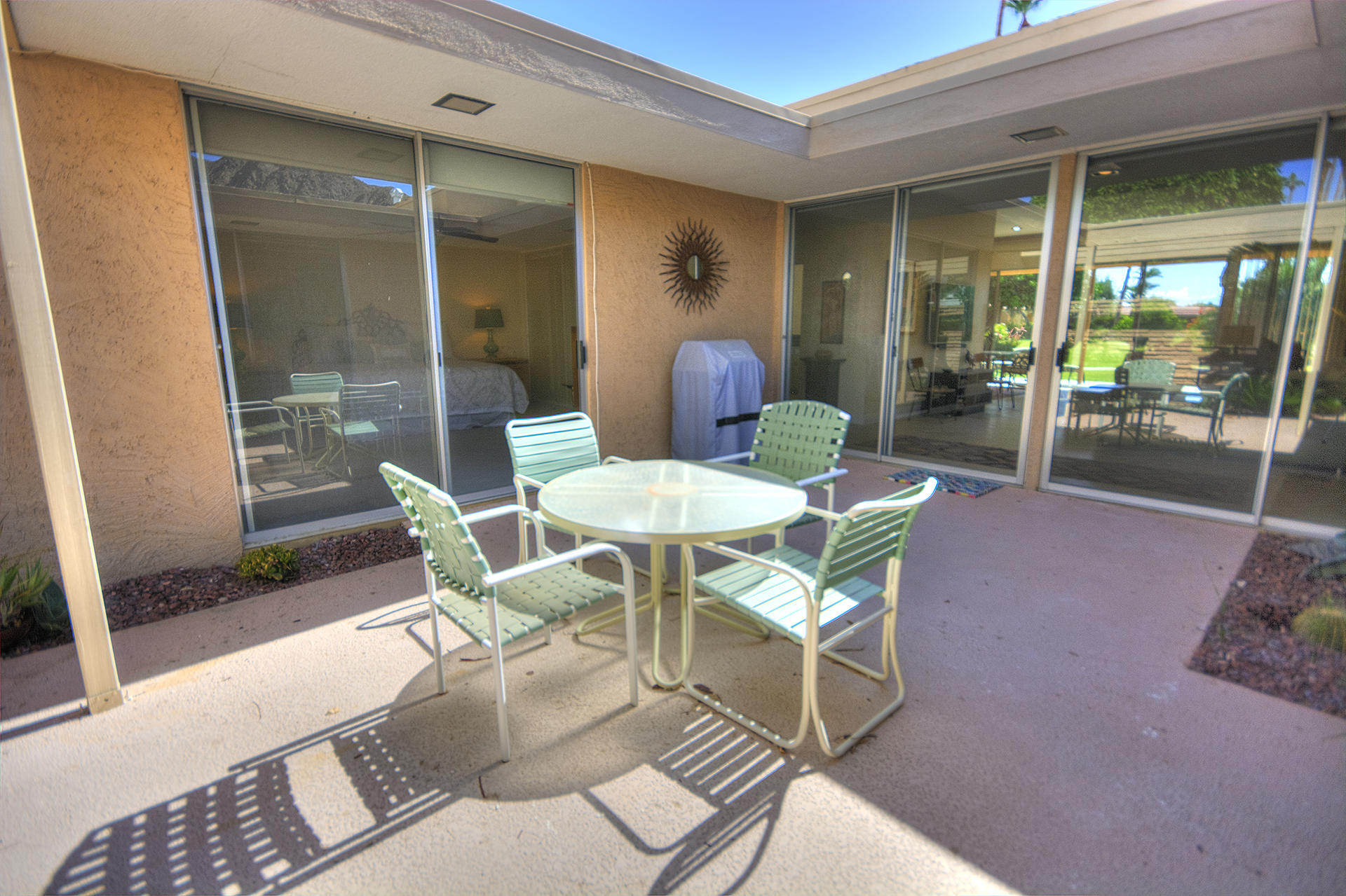 45730 Hopi Road Indian Wells, CA 92210 - Photo 30 of 42 a dining room with furniture and wooden floor