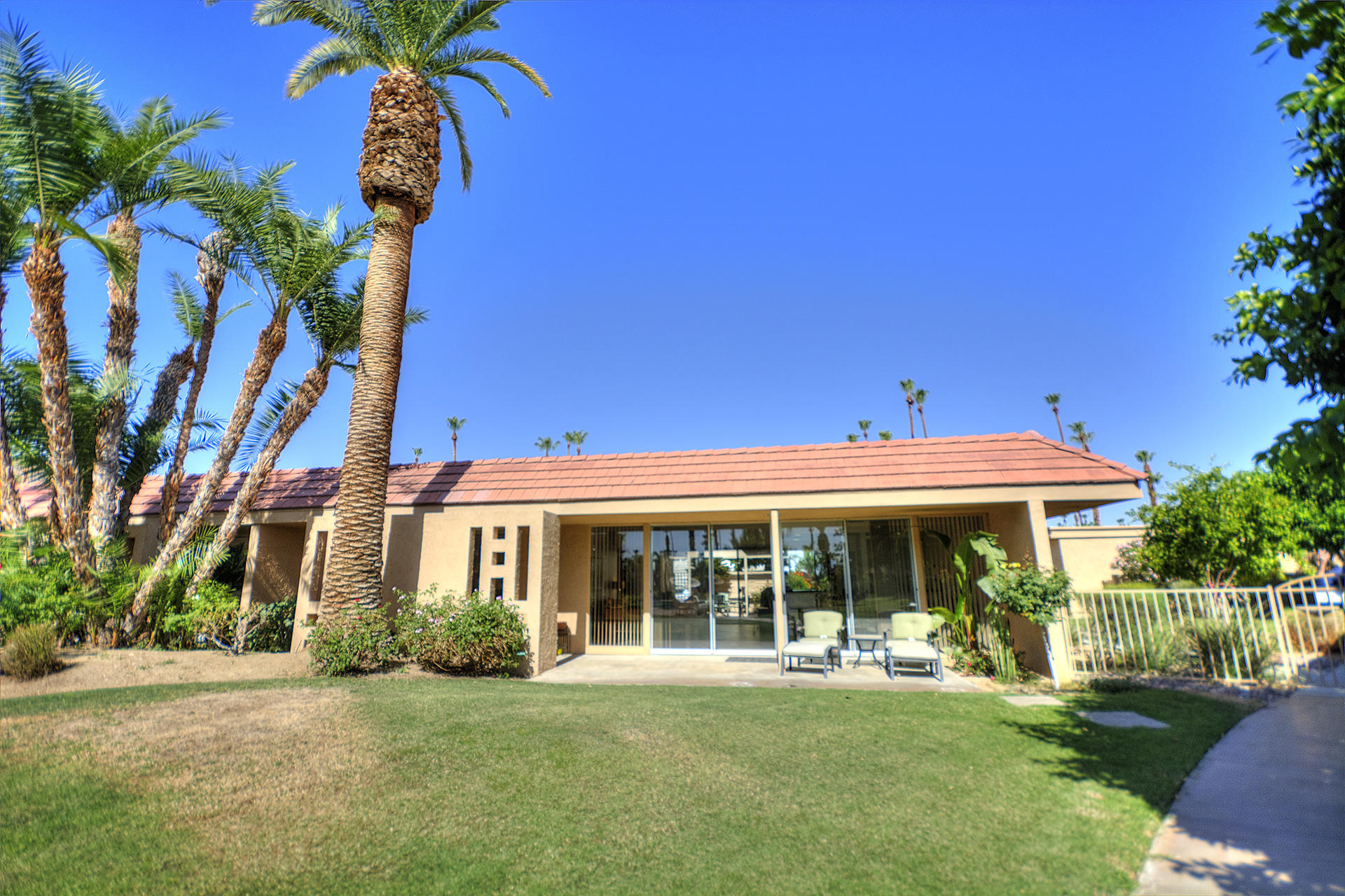 45730 Hopi Road Indian Wells, CA 92210 - Photo 34 of 42 a front view of a house with a yard