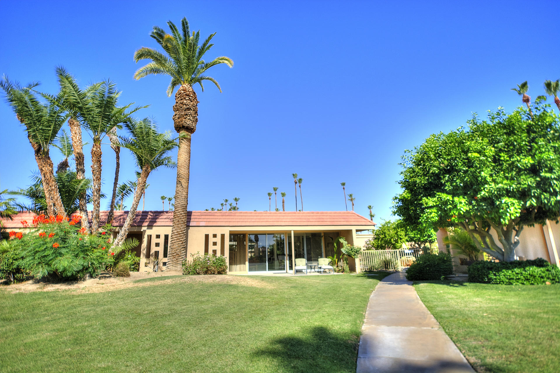 45730 Hopi Road Indian Wells, CA 92210 - Photo 35 of 42 a front view of a house with garden