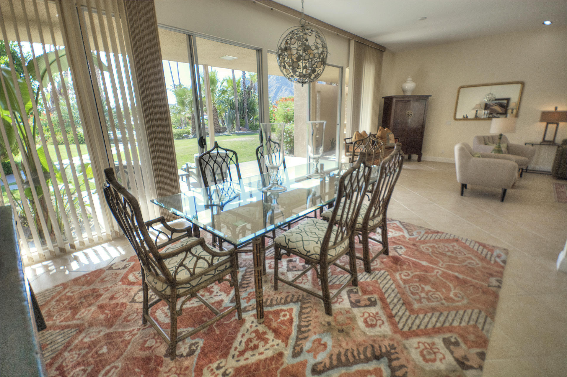 45730 Hopi Road Indian Wells, CA 92210 - Photo 8 of 42 a dining room with furniture a chandelier and wooden floor