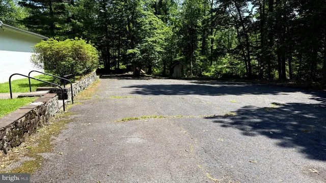 a view of water with a yard