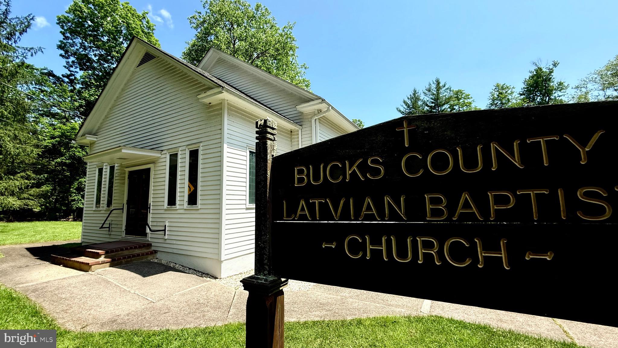 1142 Apple Road Quakertown, PA 18951 - Photo 8 of 22 a front view of a house with a garden