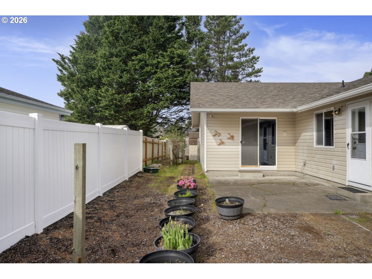 1960 40th Street Florence, OR 97439 - Photo 41 of 48 a view of a house with backyard