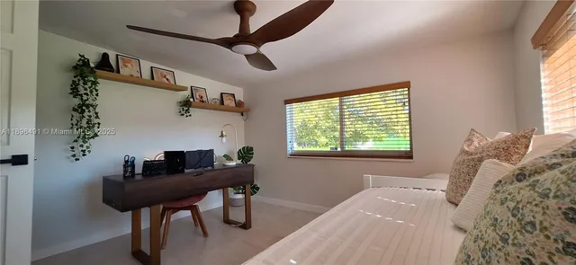 a bedroom with furniture and a window