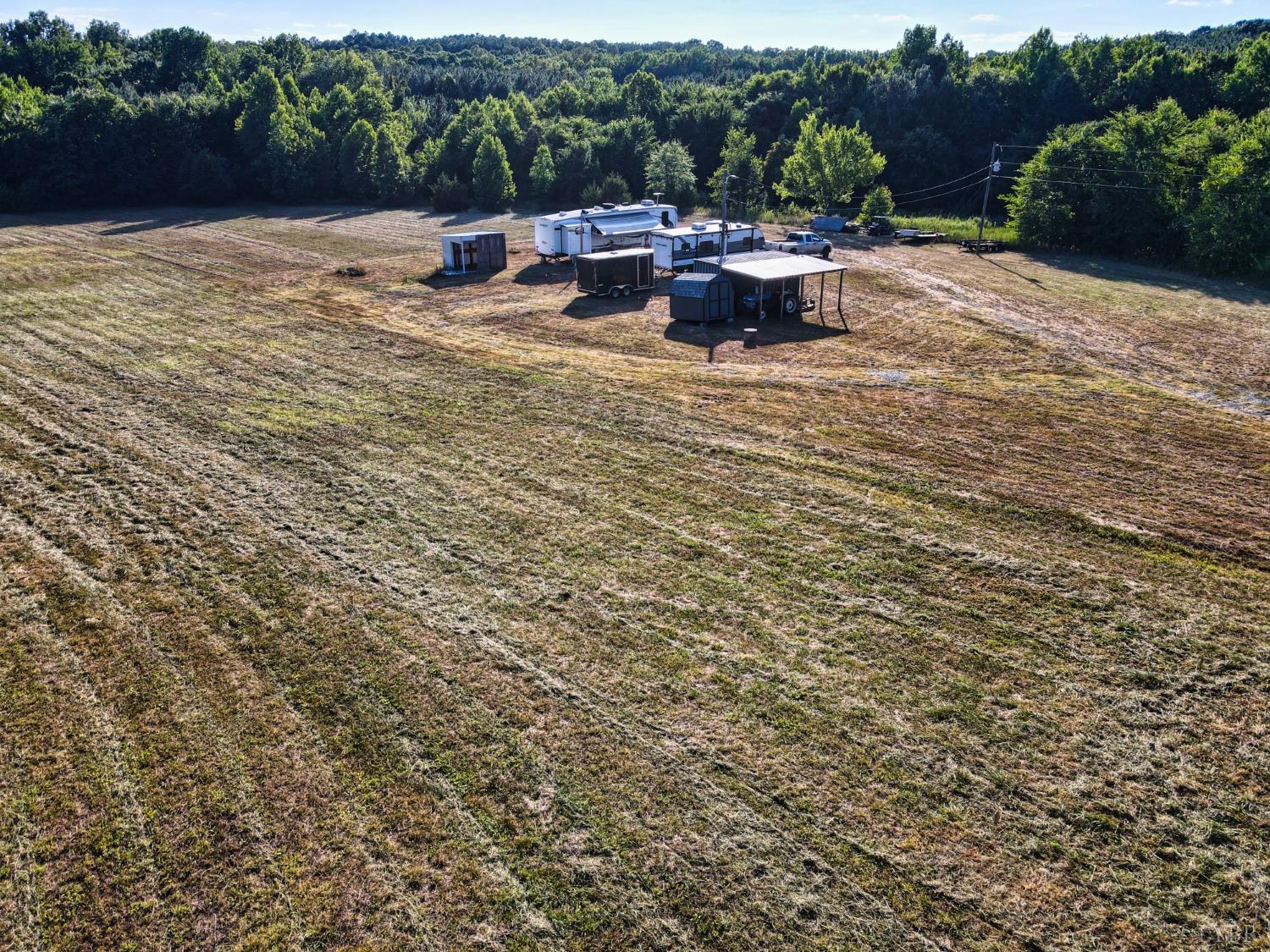 4020 Jeb Stuart Highway Red Oak, VA 23964 - Photo 13 of 48 a view of a patio with lawn chairs plants and lake view