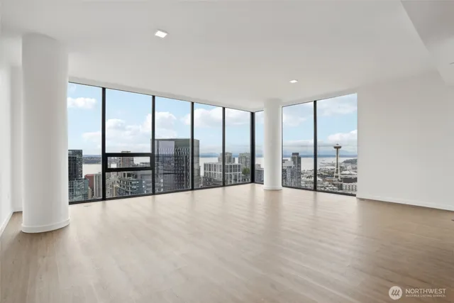 a view of an empty room with glass door