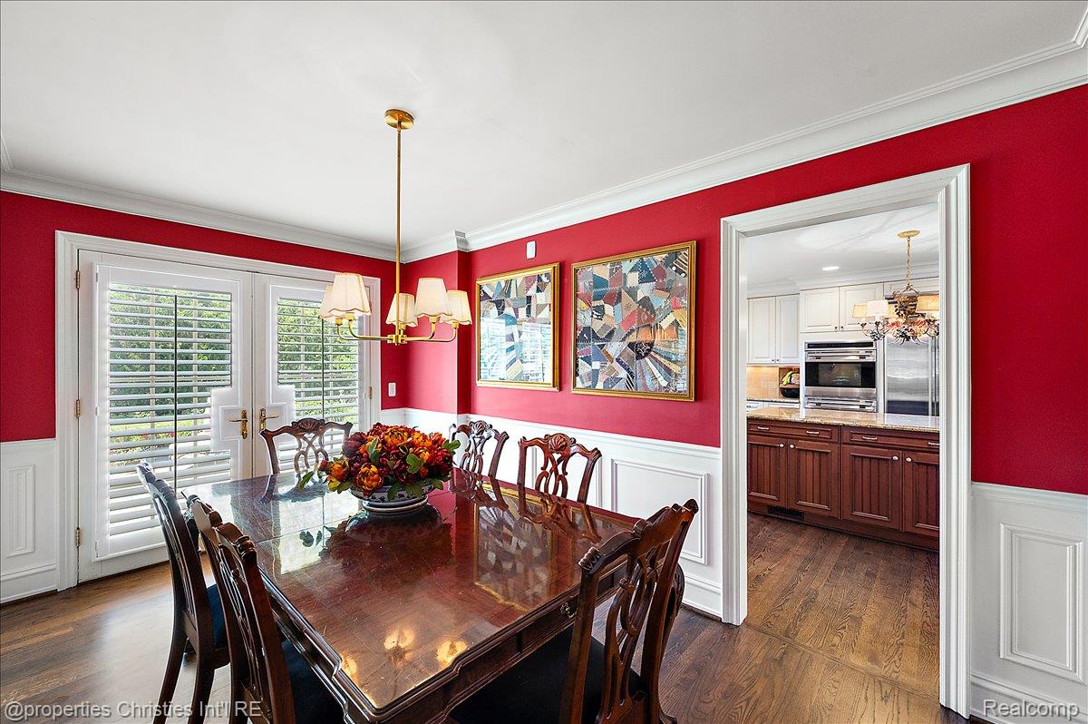 135 Clifton Road Bloomfield Hills, MI 48301 - Photo 17 of 77 Formal dining room featuring wainscoting and crown molding