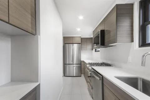 a kitchen with a refrigerator sink and microwave