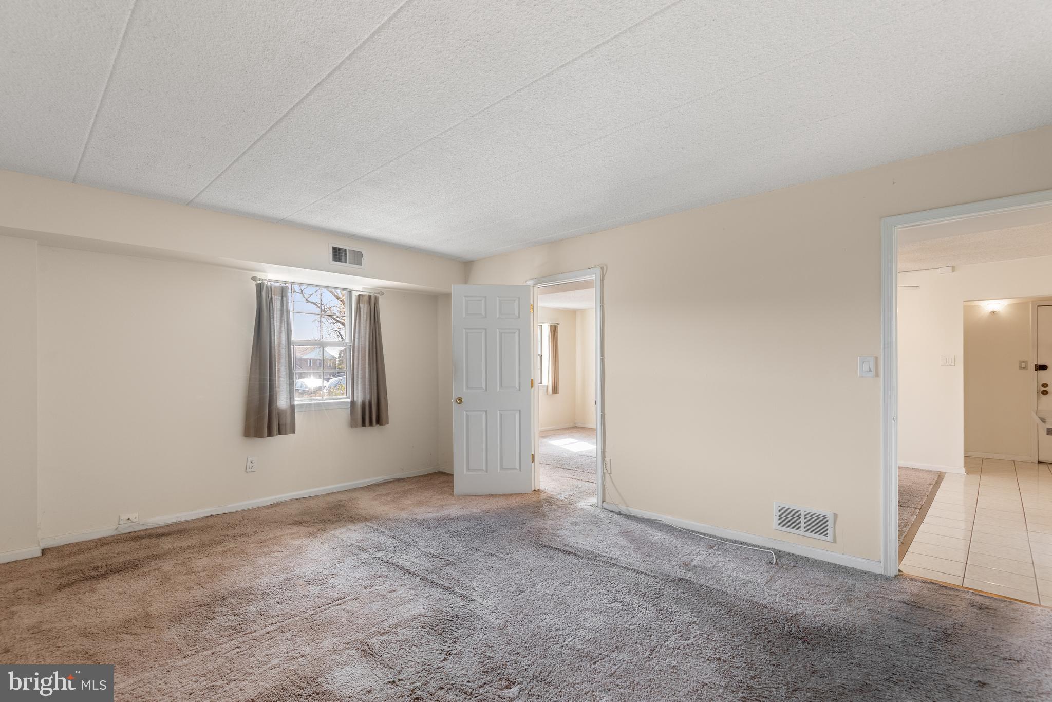 130 Riversedge Drive, Unit CONDO 130 Norristown, PA 19403 - Photo 14 of 20 a view of an empty room with a window