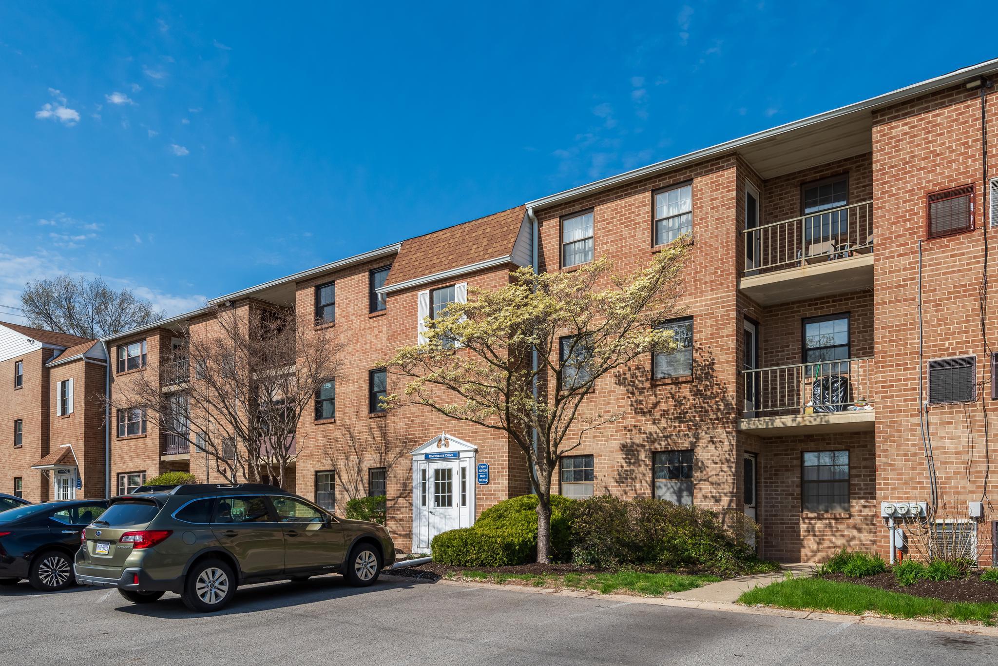 130 Riversedge Drive, Unit CONDO 130 Norristown, PA 19403 - Photo 2 of 20 a car parked in front of a building