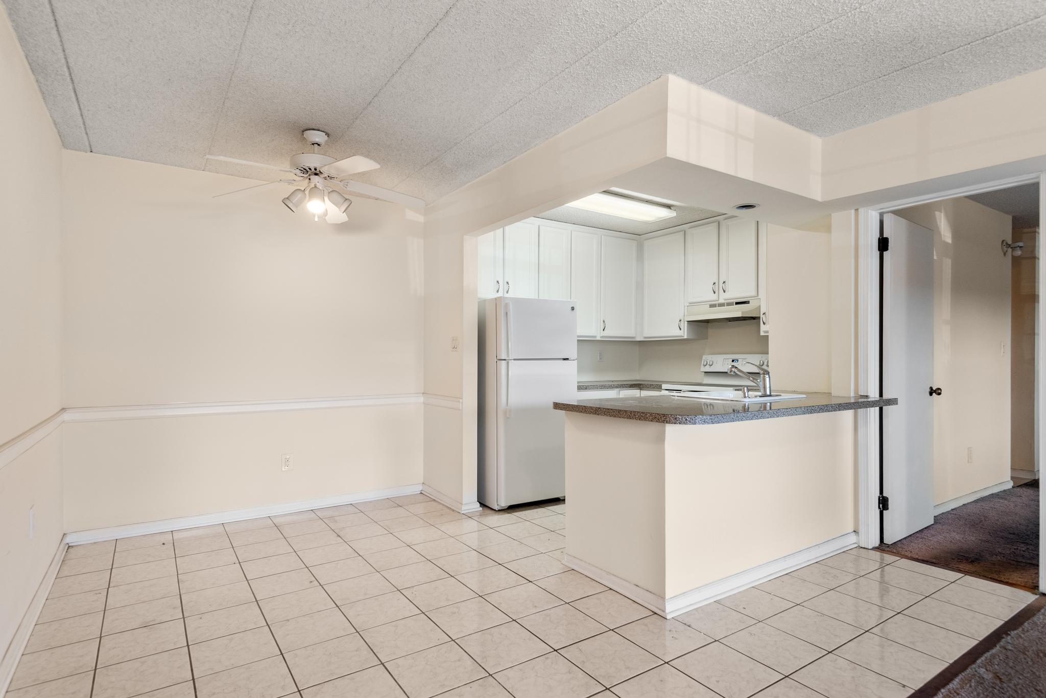 130 Riversedge Drive, Unit CONDO 130 Norristown, PA 19403 - Photo 9 of 20 a kitchen with stainless steel appliances a refrigerator and white cabinets