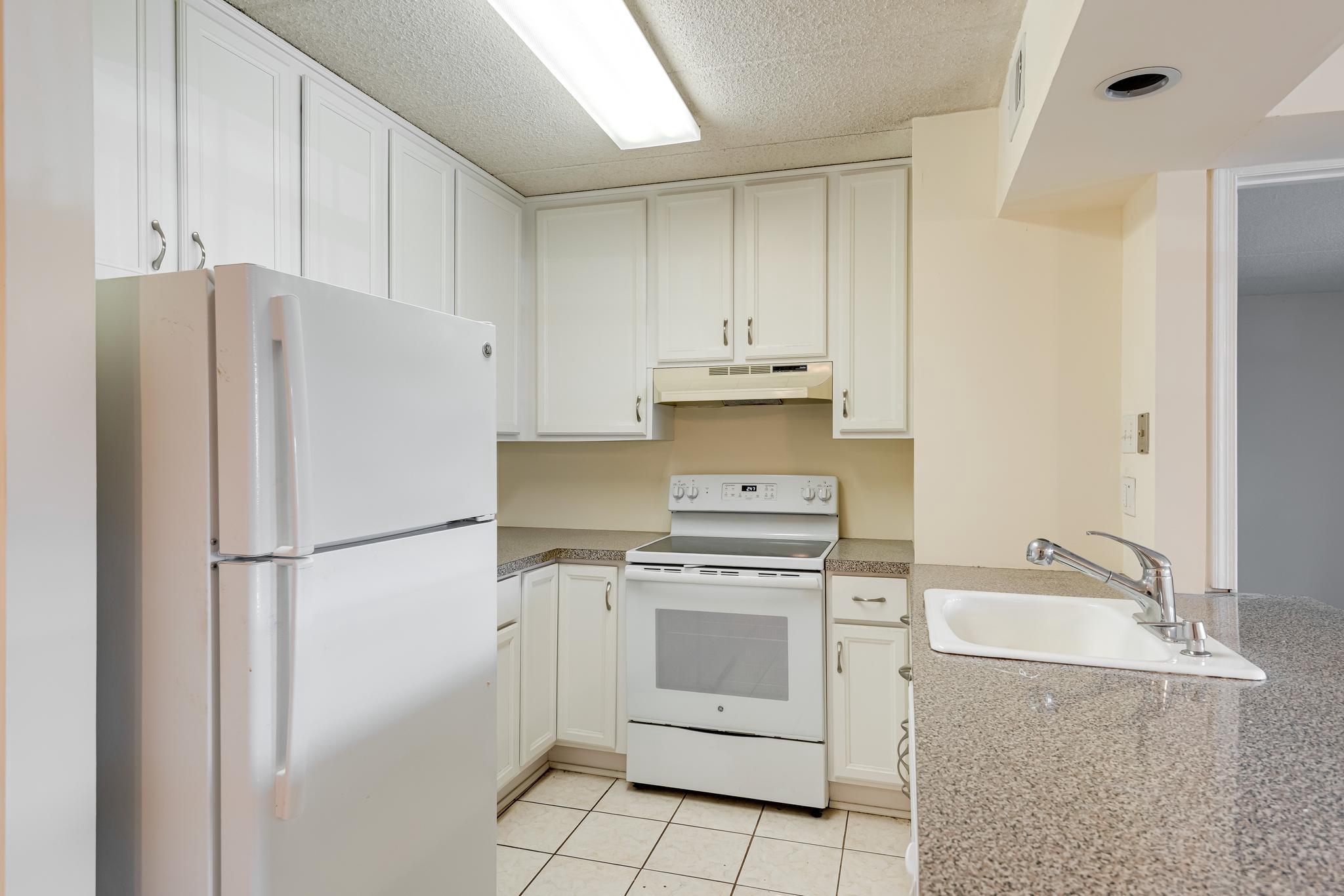 130 Riversedge Drive, Unit CONDO 130 Norristown, PA 19403 - Photo 10 of 20 a white refrigerator freezer sitting inside of a kitchen