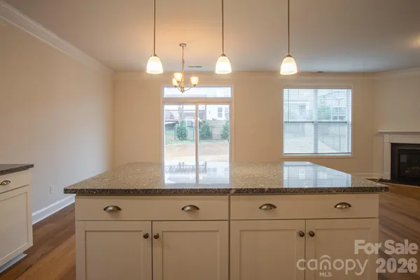 a kitchen with cabinets and window