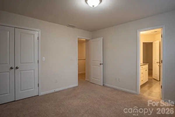 a view of an empty room and a window