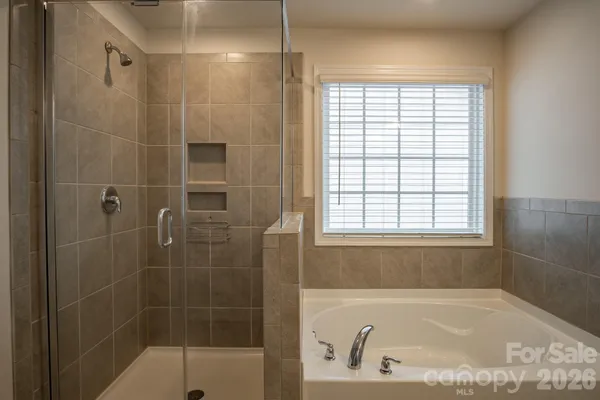 a bath tub sitting next to a window