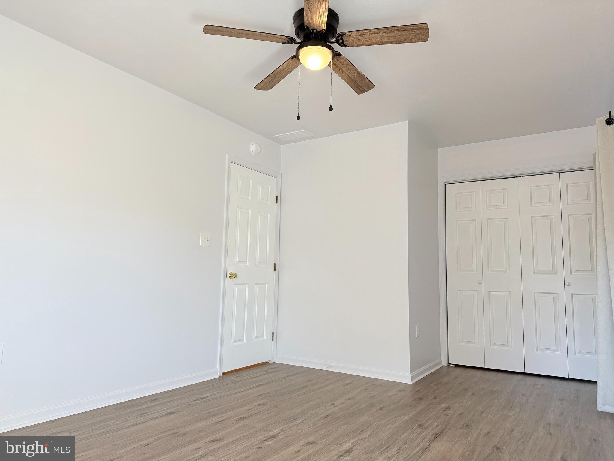 400 Franklin Street Georgetown, DE 19947 - Photo 4 of 10 wooden floor in an empty room