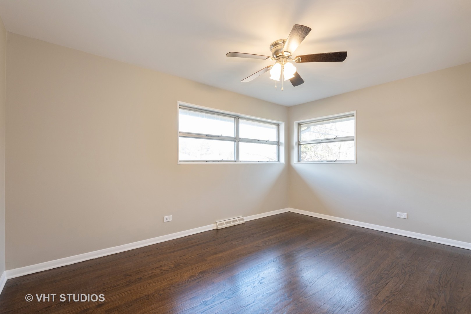 263 Riverside Drive Northfield, IL 60093 - Photo 11 of 17 wooden floor in an empty room with a window