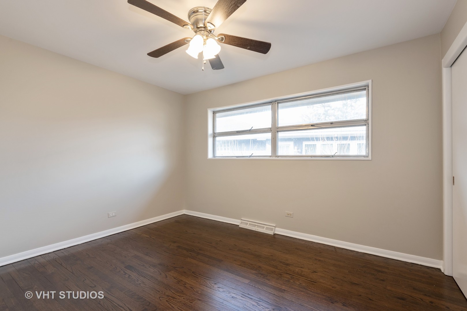 263 Riverside Drive Northfield, IL 60093 - Photo 12 of 17 a view of an empty room with wooden floor and a window