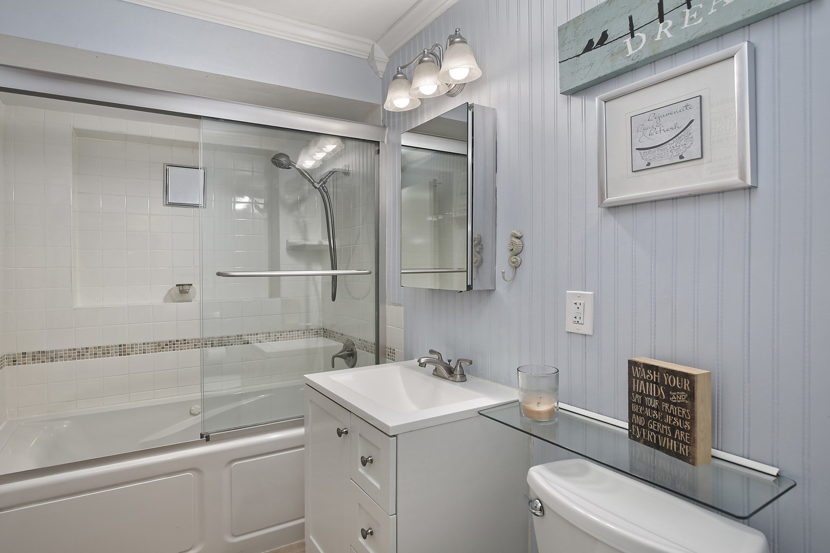 263 Riverside Drive Northfield, IL 60093 - Photo 10 of 17 a bathroom with a sink a toilet and shower