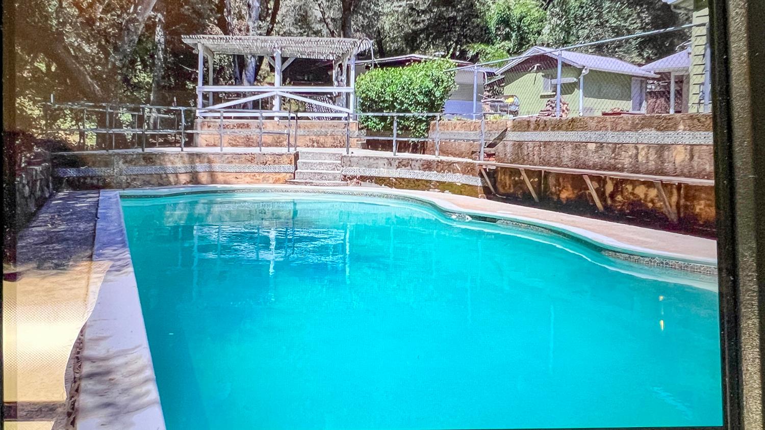 7349 Green Valley Road Placerville, CA 95667 - Photo 5 of 41 Fantastic swimming pool! Very large, even has a diving board. Plenty of room for chairs around the pool decking. It is fenced, but not to todays code.