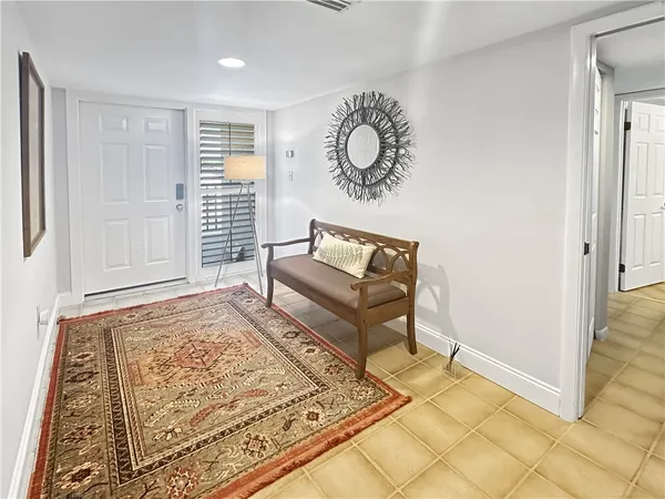 a living room with a rug and a rug