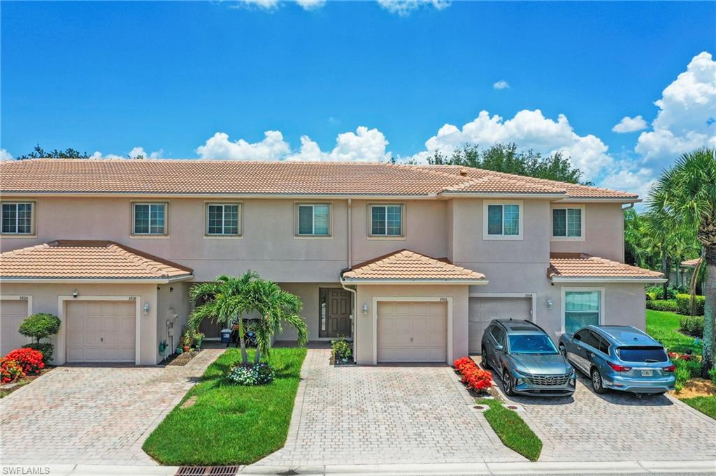 3916 Cherrybrook Loop Fort Myers, FL 33966 - Photo 23 of 31 Multi-unit residence featuring a neutral exterior, tile roofing, and multiple windows