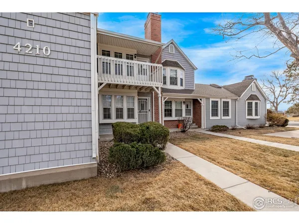 a view of a yard in front of a brick house