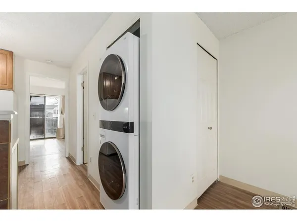 a view of a hallway with washer and dryer