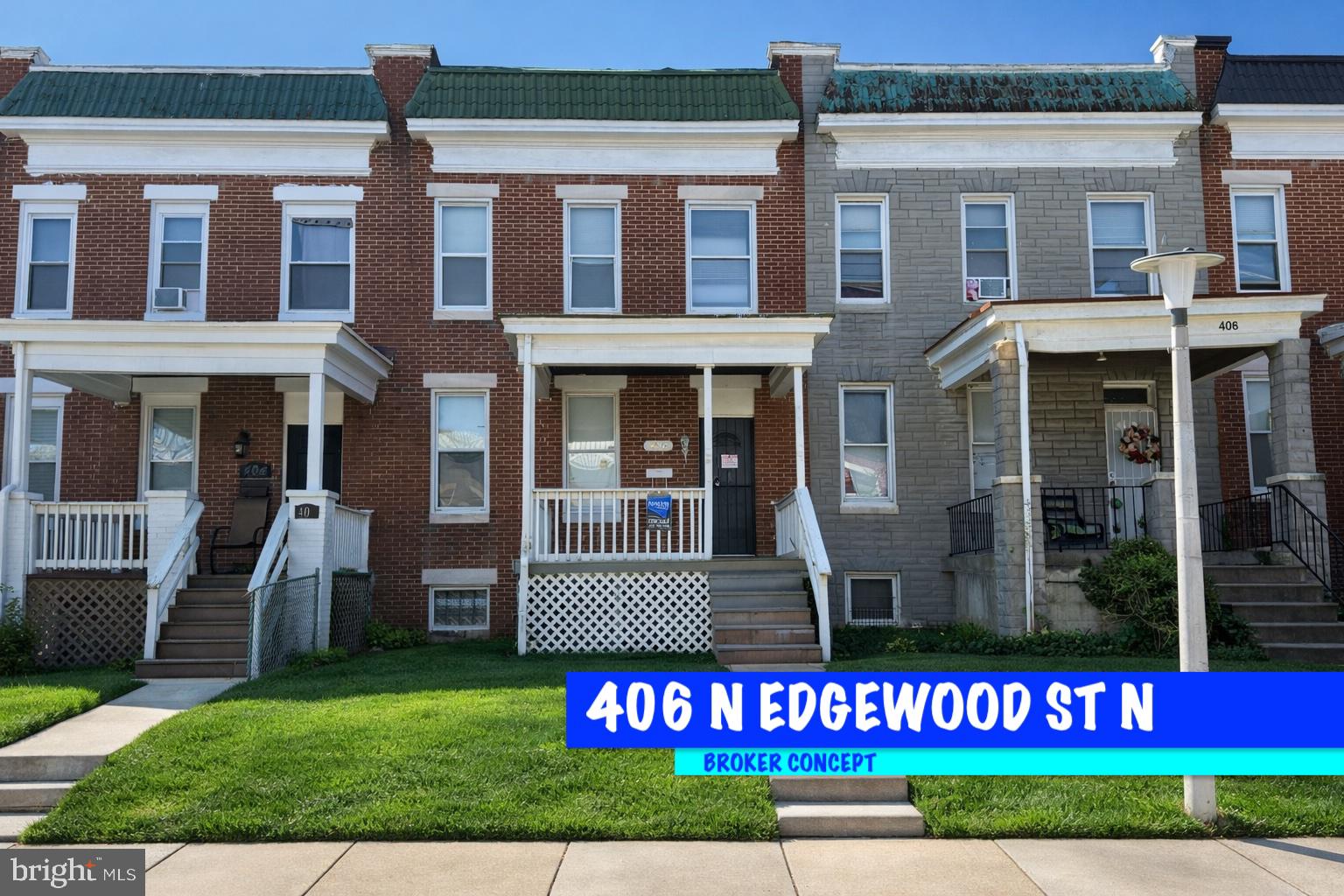 406 Edgewood Street Baltimore, MD 21229 - Photo 1 of 12 a view of a brick building with a lot of windows and a yard