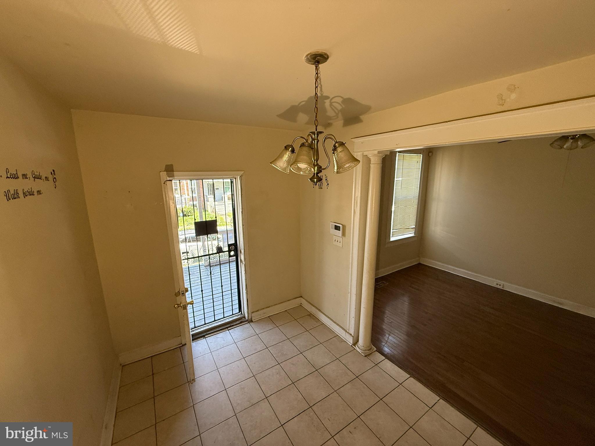 406 Edgewood Street Baltimore, MD 21229 - Photo 4 of 12 a view of a hallway with a chandelier