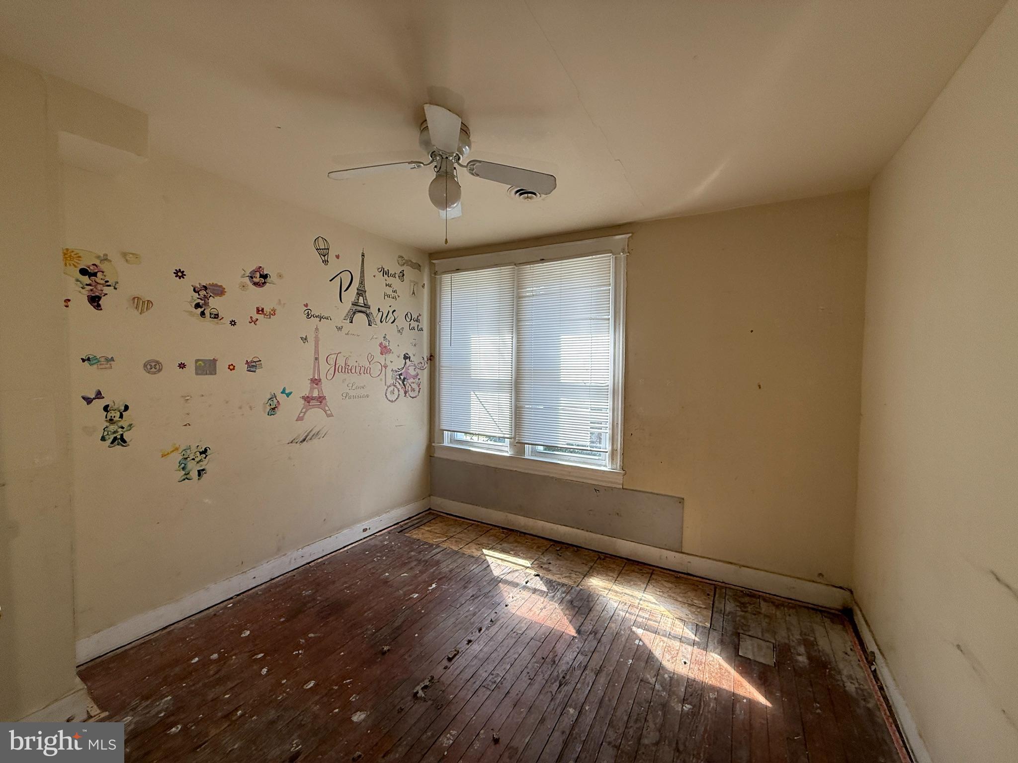 406 Edgewood Street Baltimore, MD 21229 - Photo 5 of 12 a view of empty room with window and ceiling fan