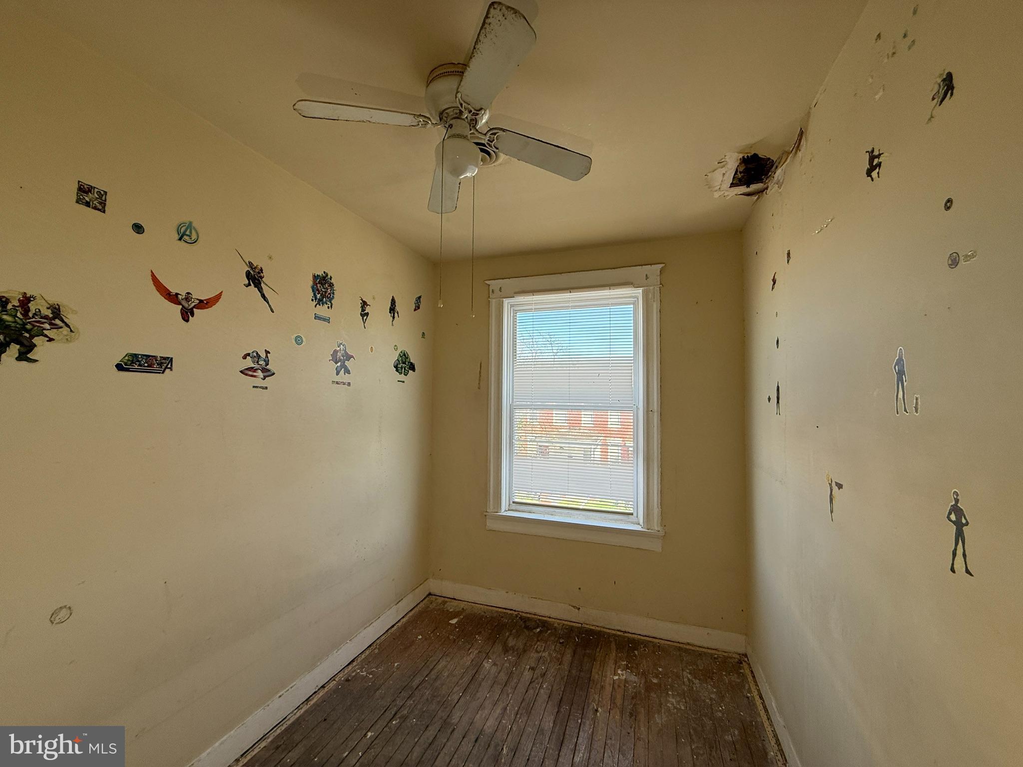 406 Edgewood Street Baltimore, MD 21229 - Photo 7 of 12 a view of a hallway with a window