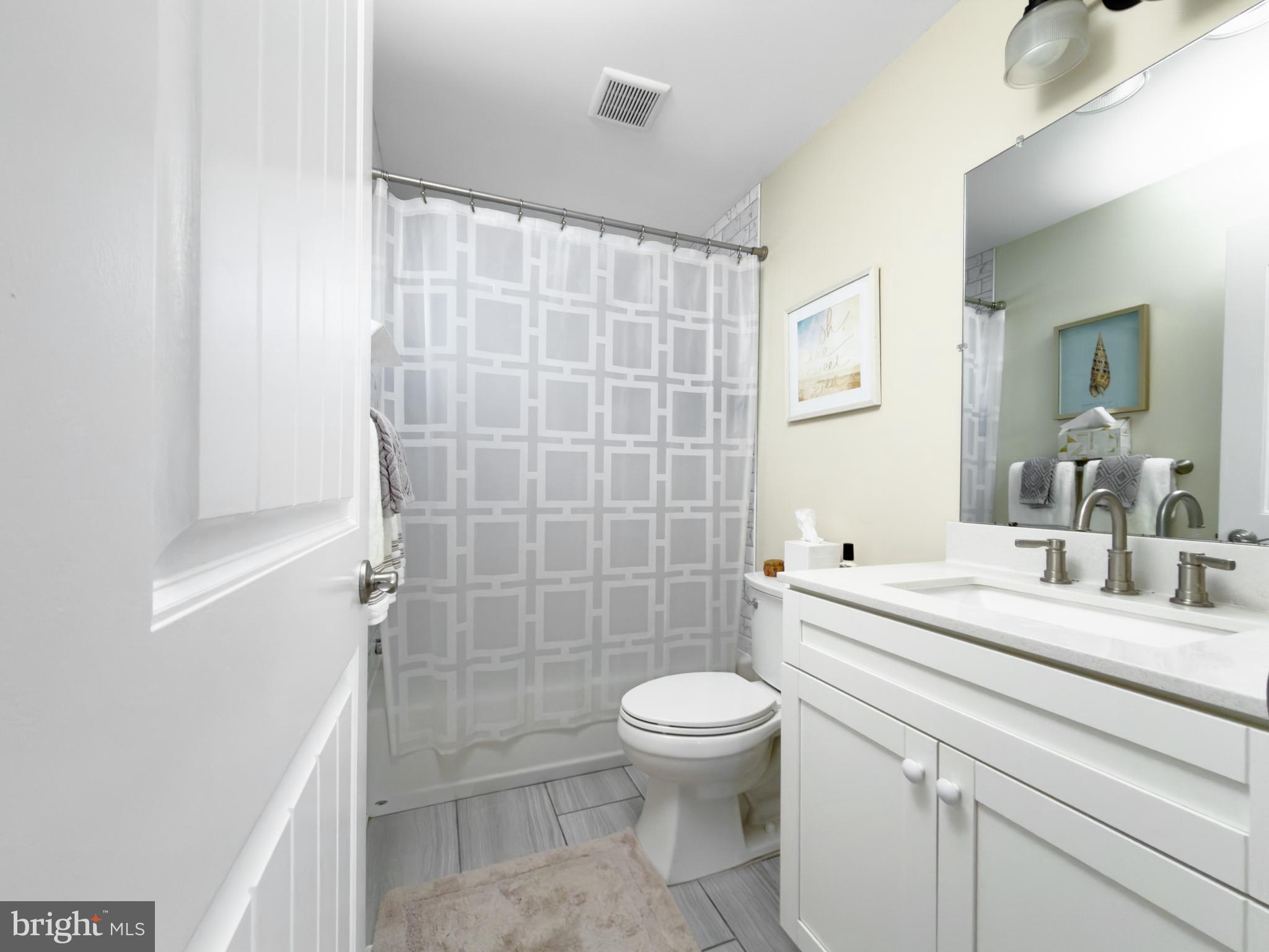 204 10th Street North Brigantine, NJ 08203 - Photo 17 of 88 a bathroom with a sink a toilet and shower