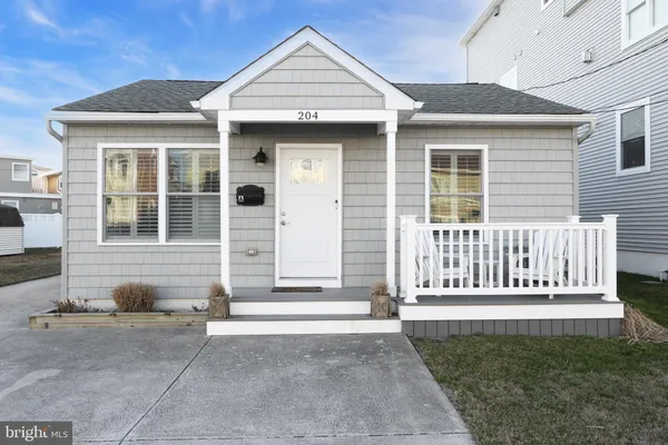 a front view of a house with a porch