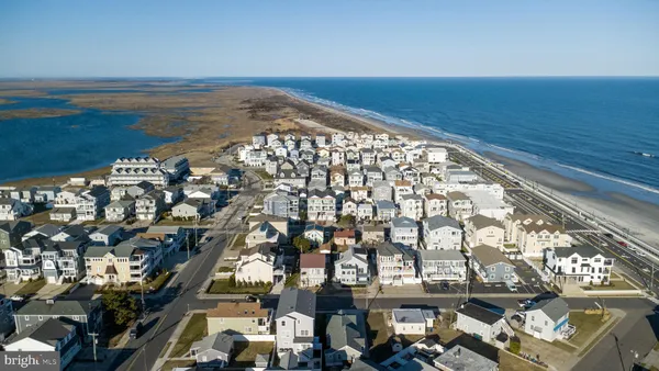 an aerial view of a building with a ocean view