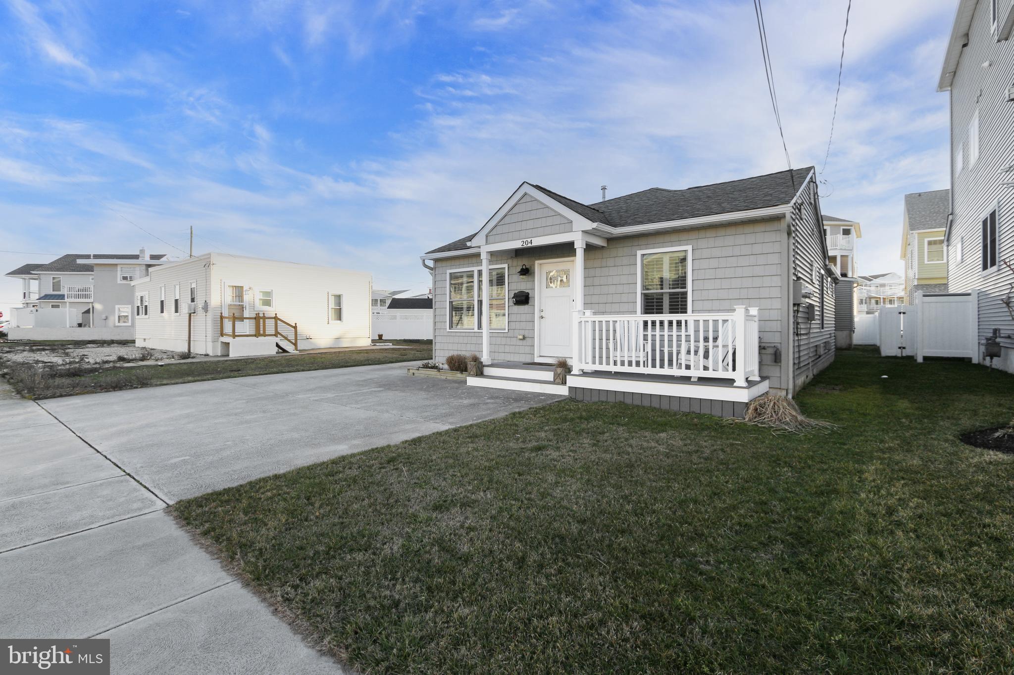204 10th Street North Brigantine, NJ 08203 - Photo 80 of 88 a view of a house with a yard and fence