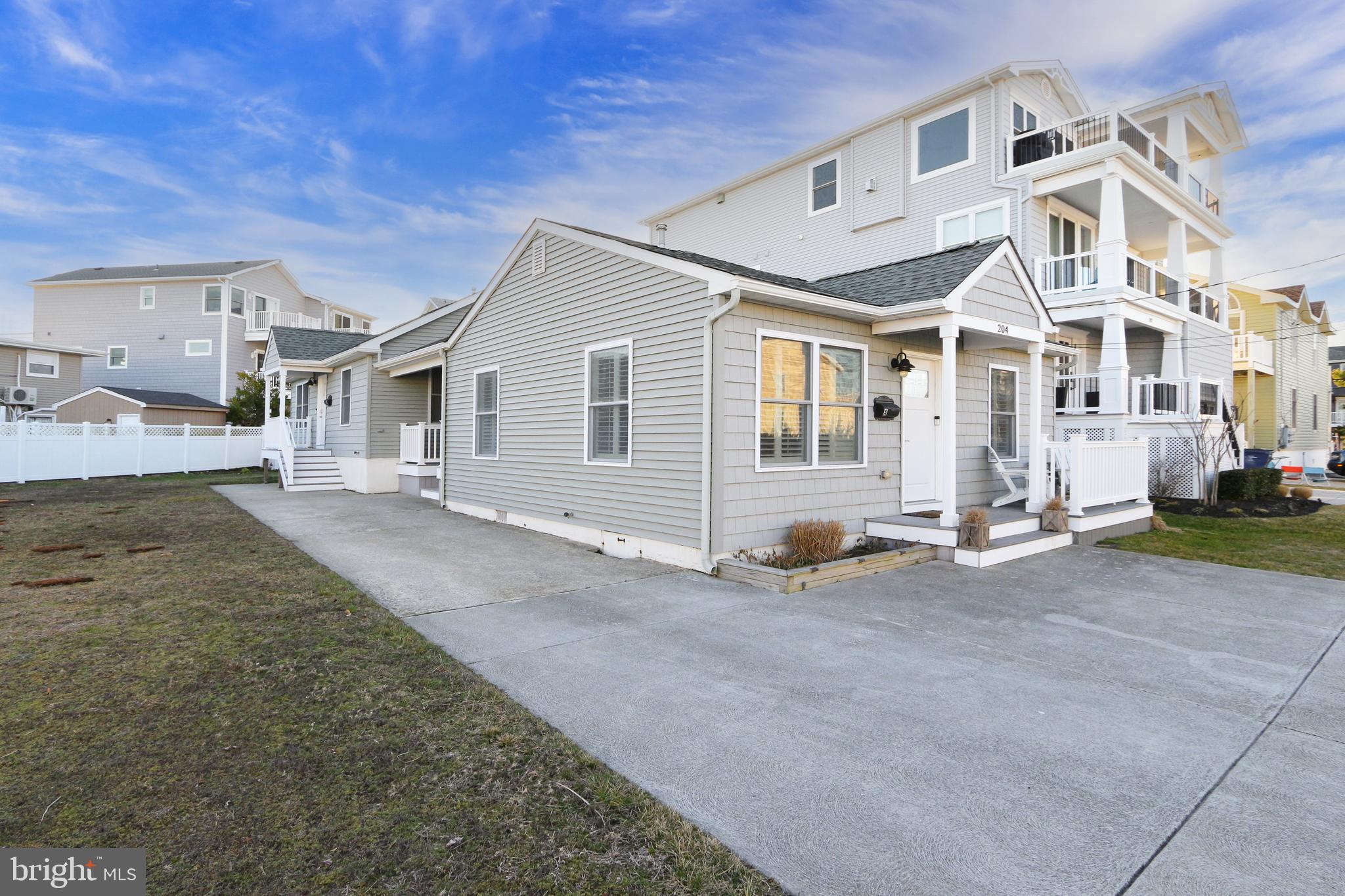 204 10th Street North Brigantine, NJ 08203 - Photo 83 of 88 a view of a white house with a outdoor space